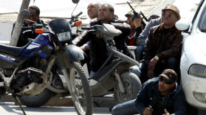 Police officers are seen on the pavement outside parliament in Tunis