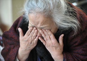 TO GO WITH AFP STORY by SHINGO ITO - FILES - This picture taken on March 25, 2011 shows Tsuyako Ito wiping tears during an interview at a shelter in Kamaishi, Iwate prefecture. The "last geisha" of this once-bustling steel city says she lost everything from her kimono to music instruments as a huge tsunami swept them away, but her performing spirit remains intact. AFP PHOTO / KAZUHIRO NOGI (Photo credit should read KAZUHIRO NOGI/AFP/Getty Images)