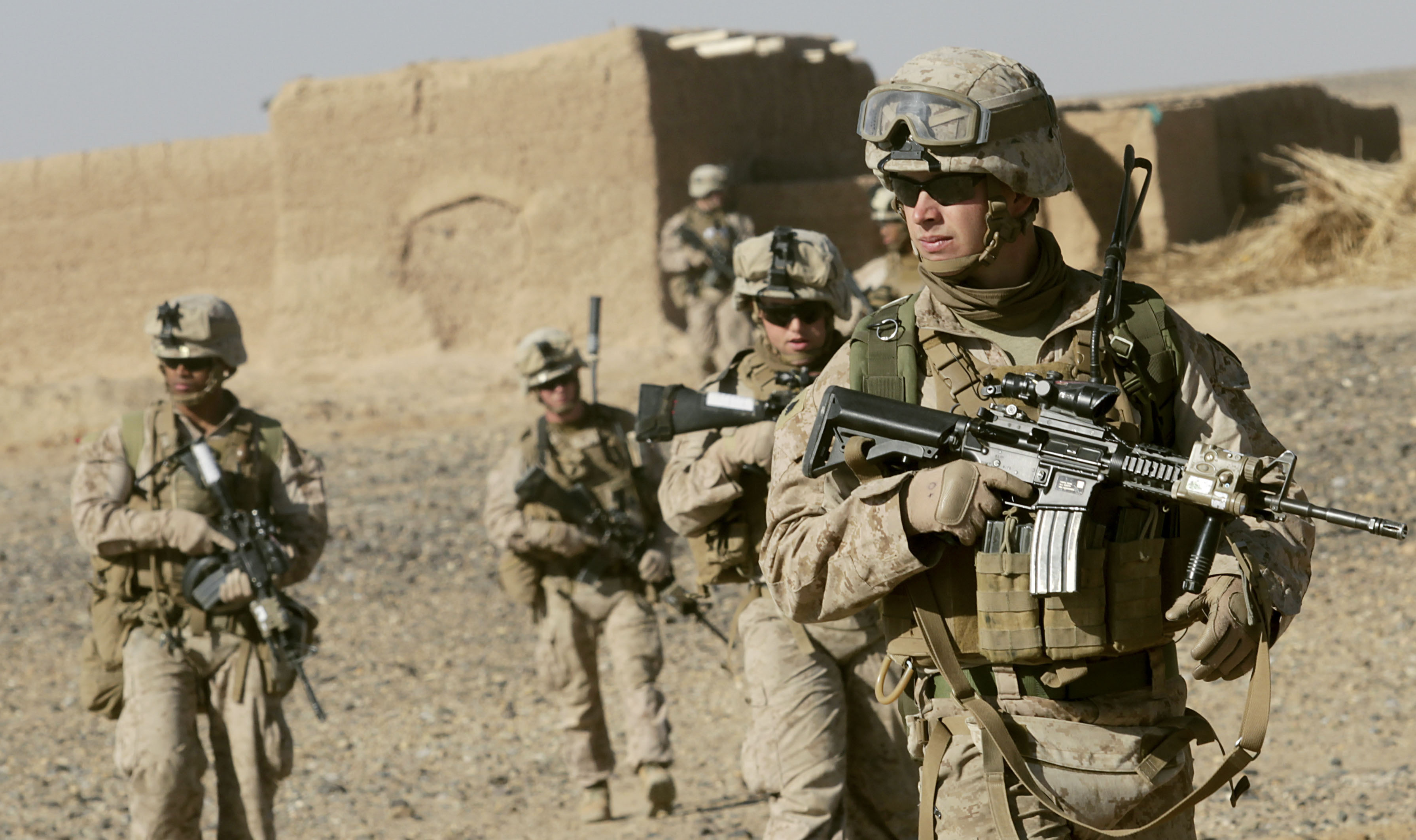 U.S. Marine Sgt. Bryan Early, a squad leader with 1st Battalion, 9th Marine Regiment, leads his squad of Marines to the next compound while patrolling in Helmand province, Afghanistan, Dec. 19. Early is responsible for planning the squad's patrols, the safety of his Marines, and achieving his commander's intent, before, during, and after an operation. (U.S. Marine Corps photo by Cpl. Austin Long)